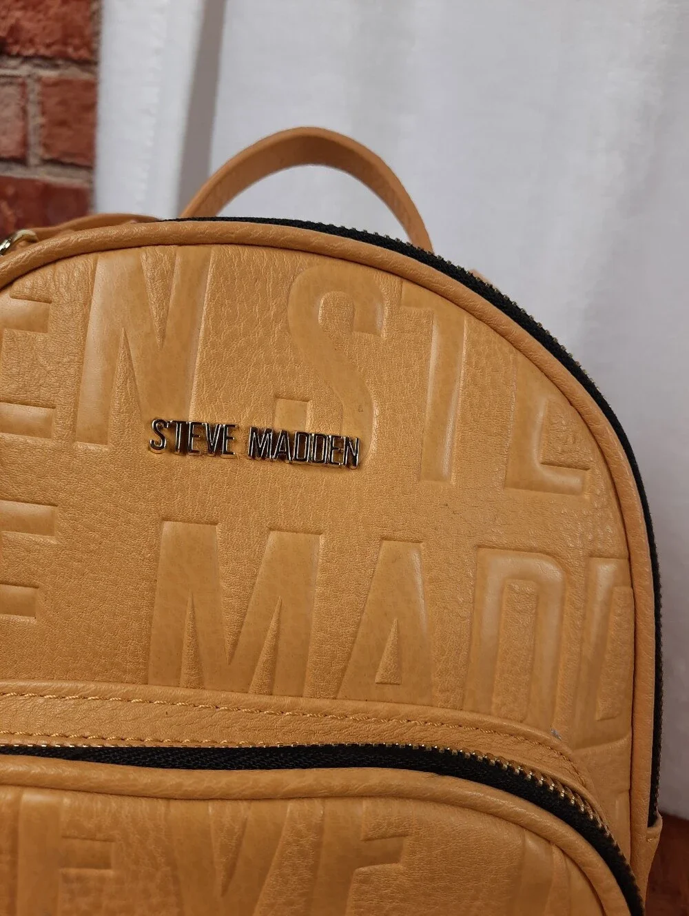Steve Madden Mustard Mini Tassel Backpack